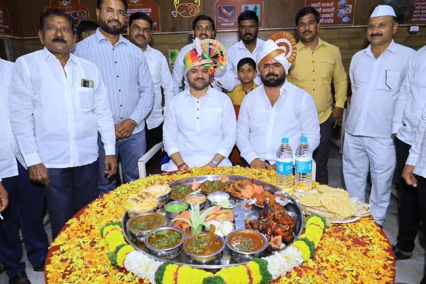 Hotel Shivraj's giant ceremonial thali surrounded by guests